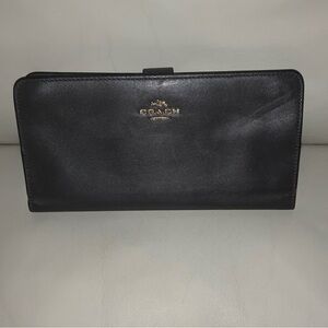 COACH Bifold Leather Slim Wallet with various compartments. Good condition.
